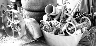 grayscale photo of trike near tires