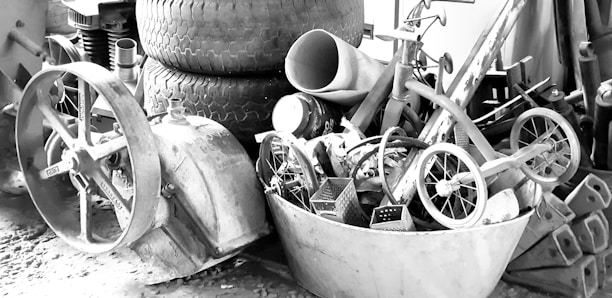 grayscale photo of trike near tires