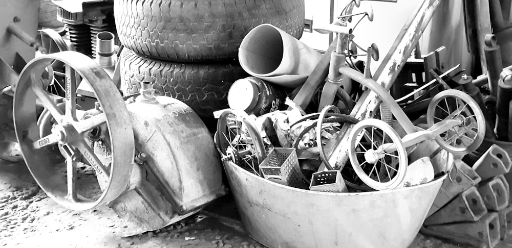 grayscale photo of trike near tires
