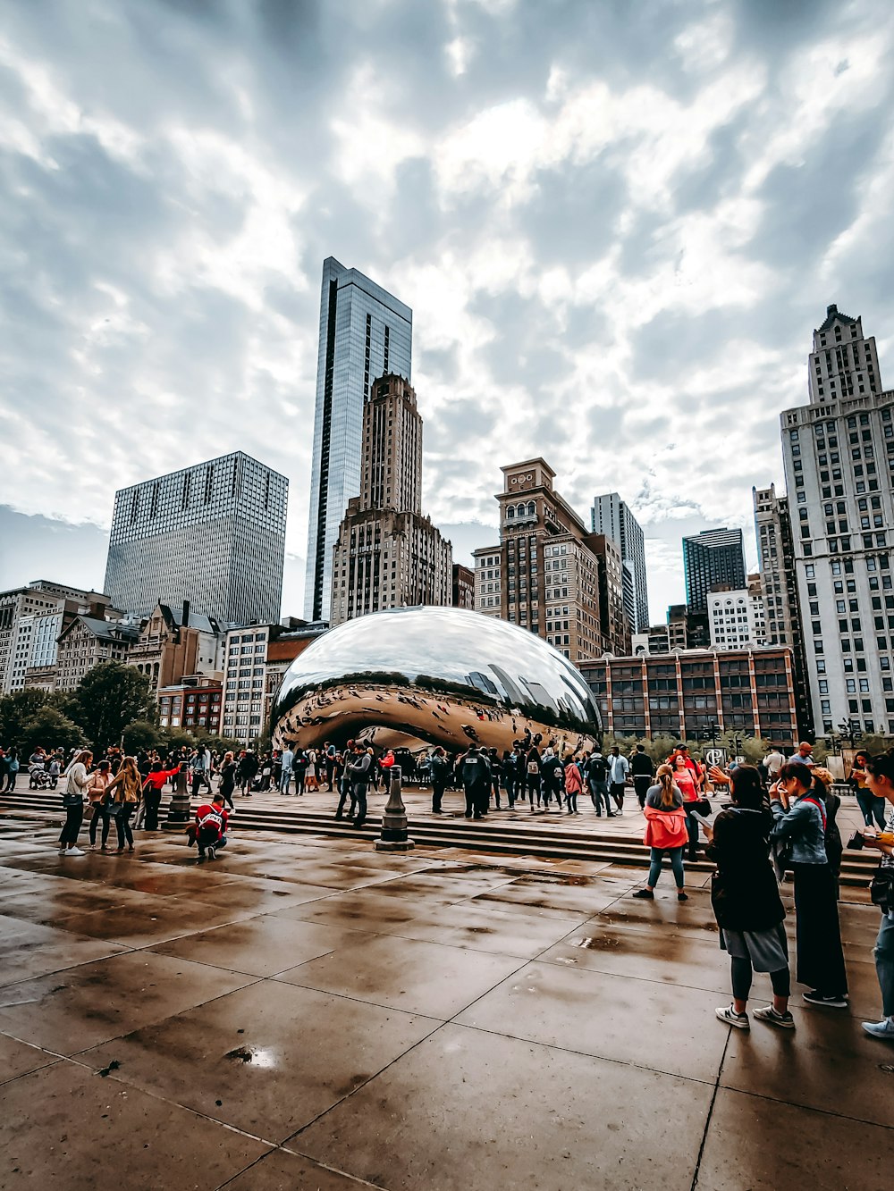 people walking near Cloud Gate in Chicago during daytime