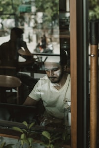 A professional working on a laptop in a café with strong Wi-Fi signal.