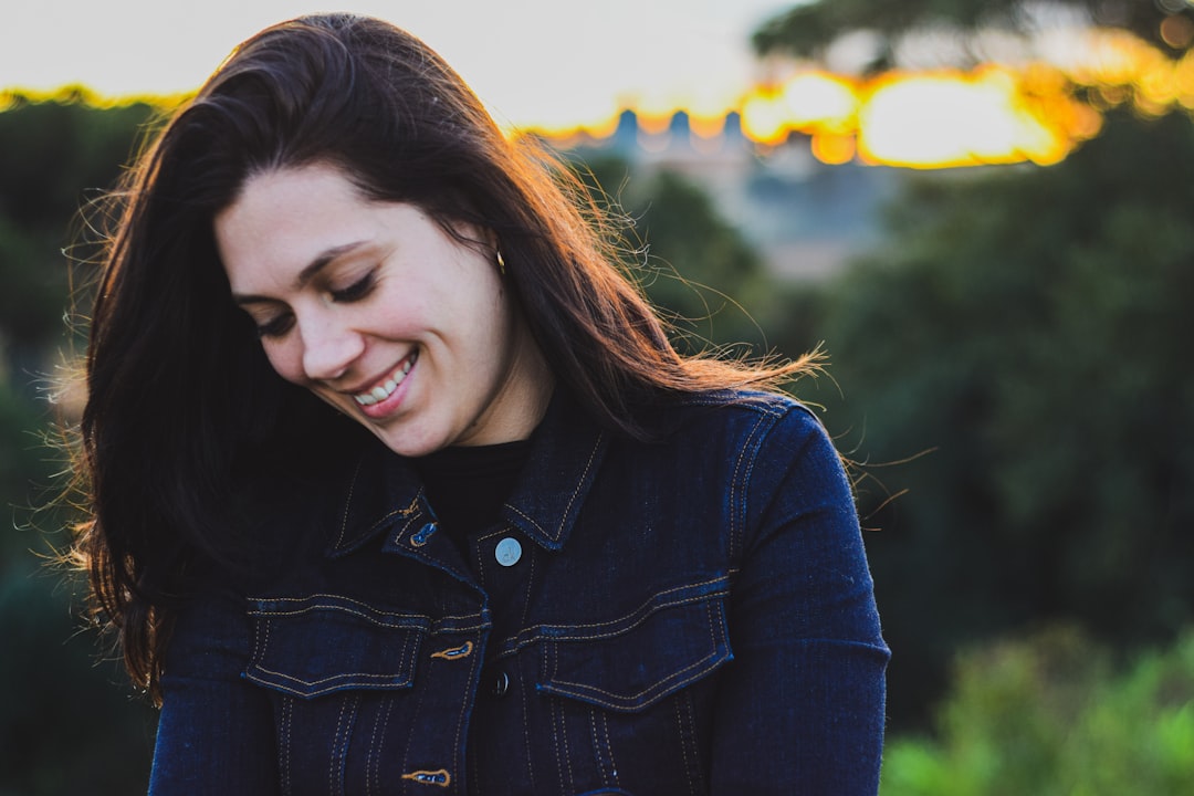 woman wearing blue denim jacket