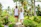 Couple listening to a guide beside tropical palm trees on Saona Island