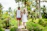 Smiling tourist couple enjoying a lush guided tour in the tropical forests of São Tomé