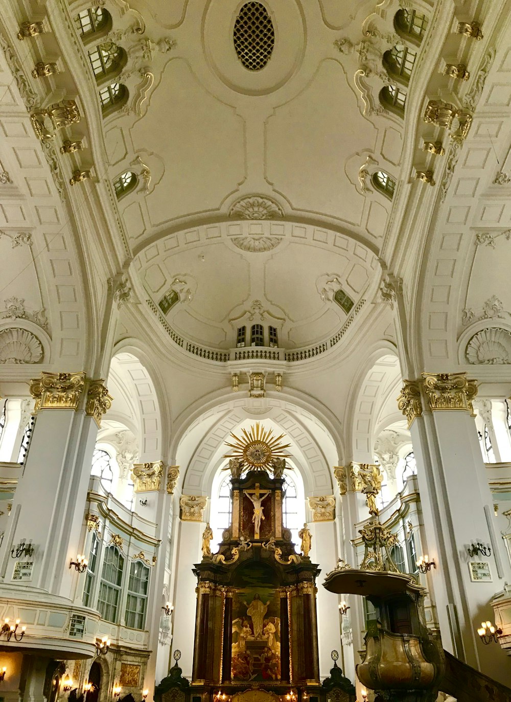 white and gold painted cathedral ceiling