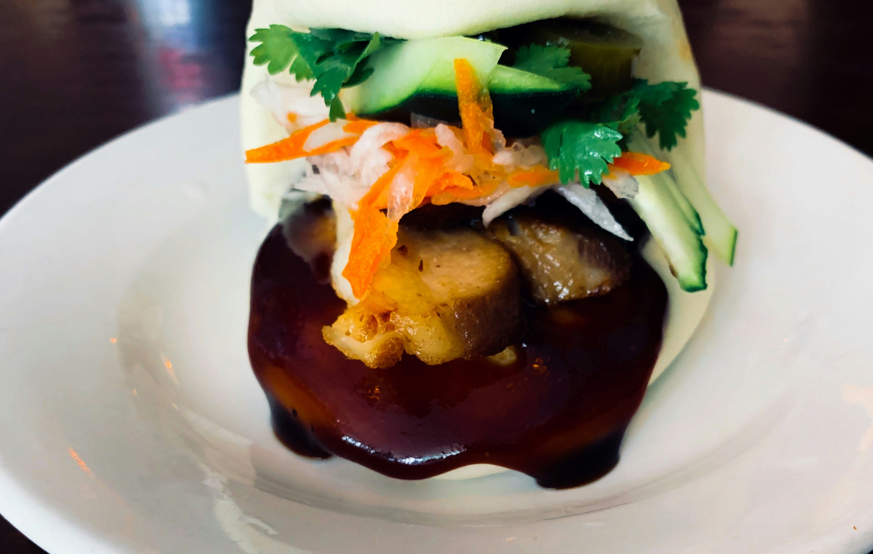 Steamed bao with braised pork and sauce