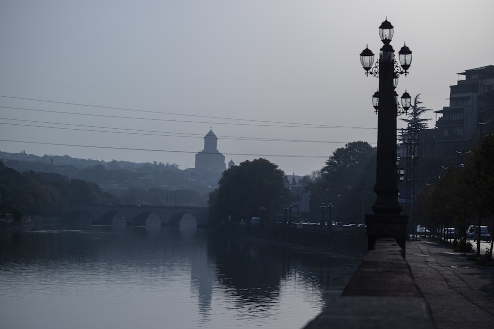 black street light in bank of river