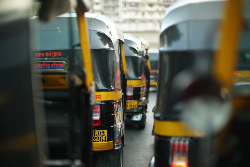 yellow and black autorickshaw