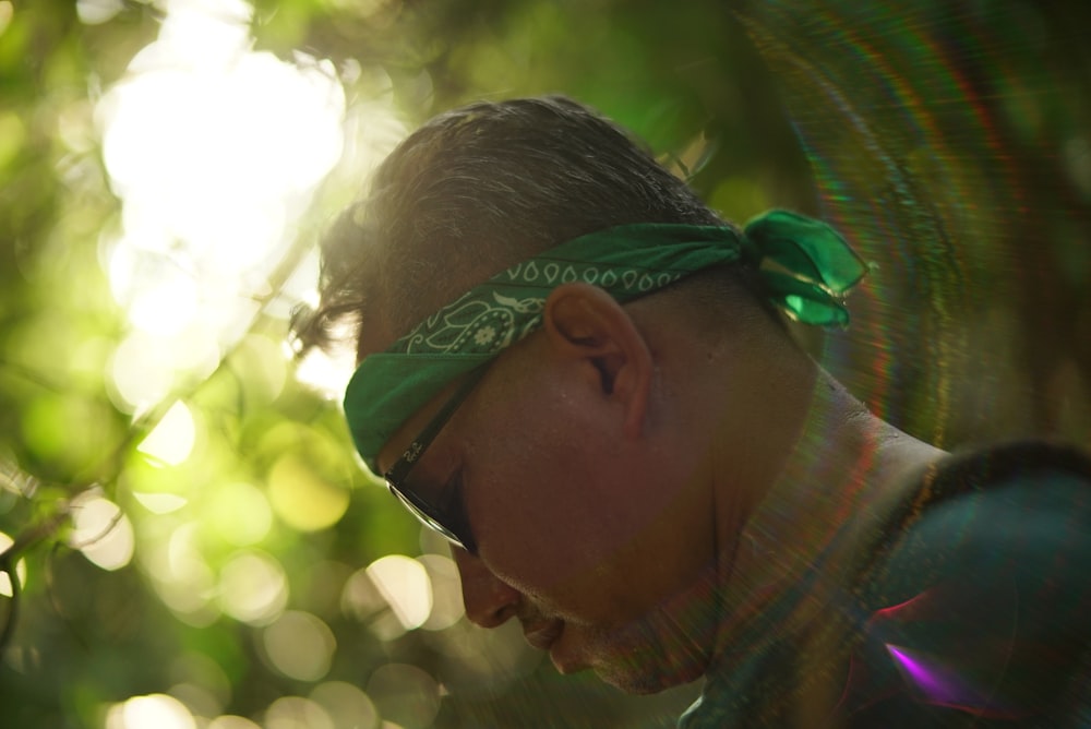 man wearing green and white bandana