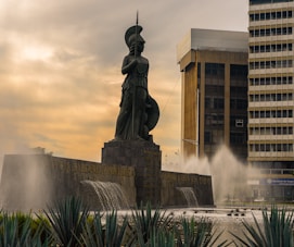 grey knight statue near building