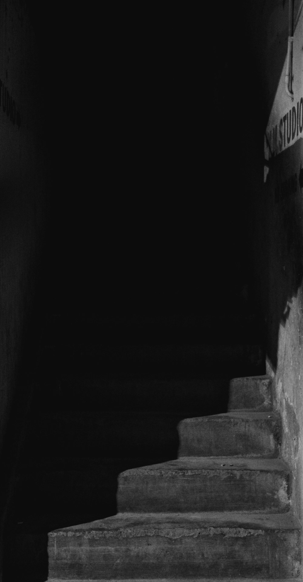 grayscale photo of concrete stairs