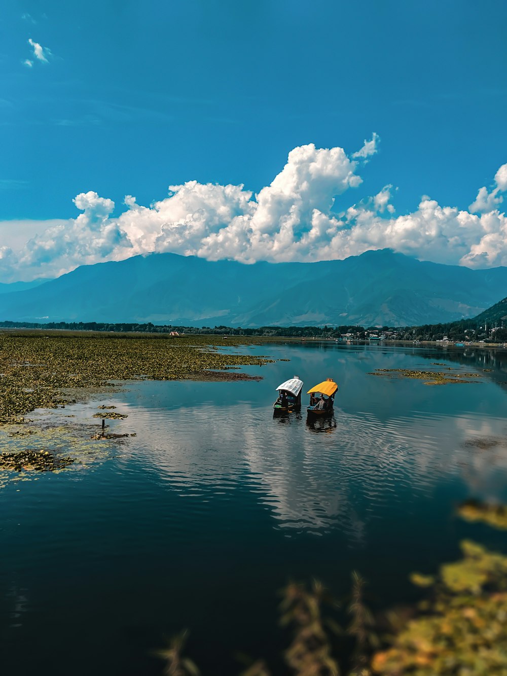 two boats on body of water during daytime