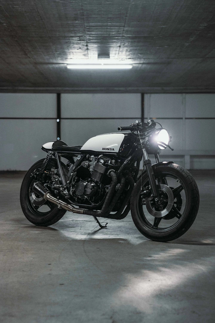A custom Honda CB750 cafe-racer photographed from the right side