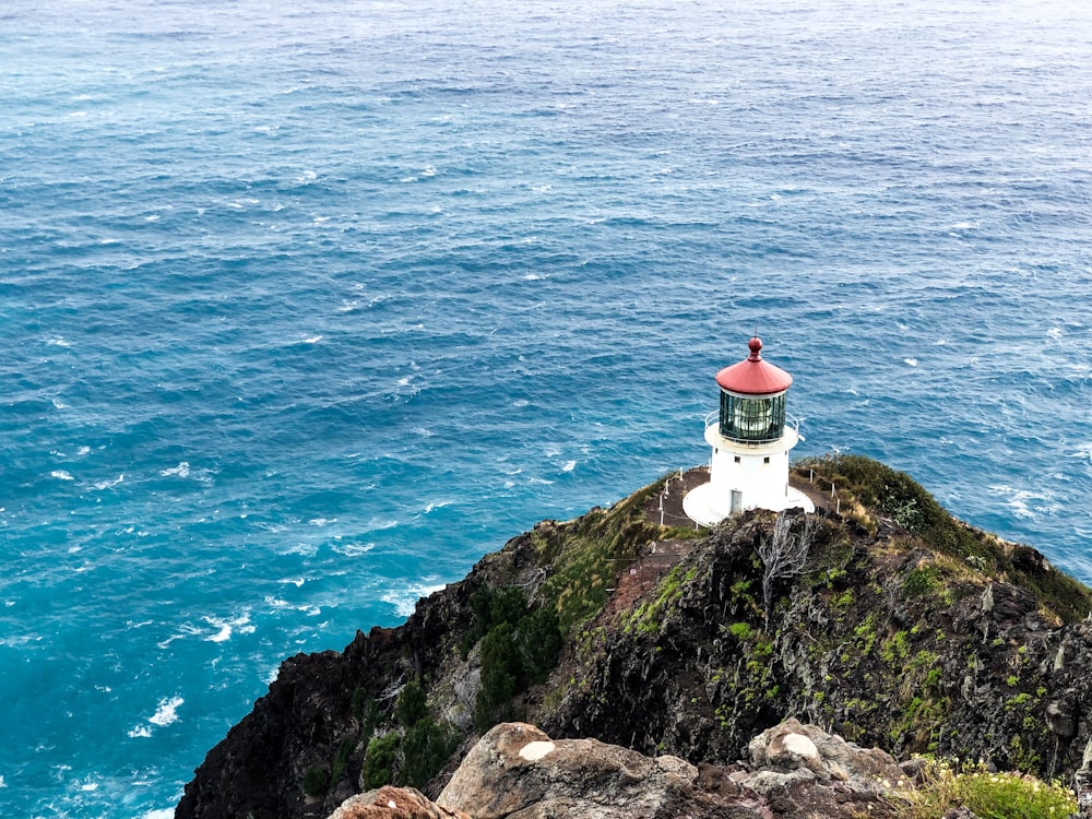 white lighthouse near ocean