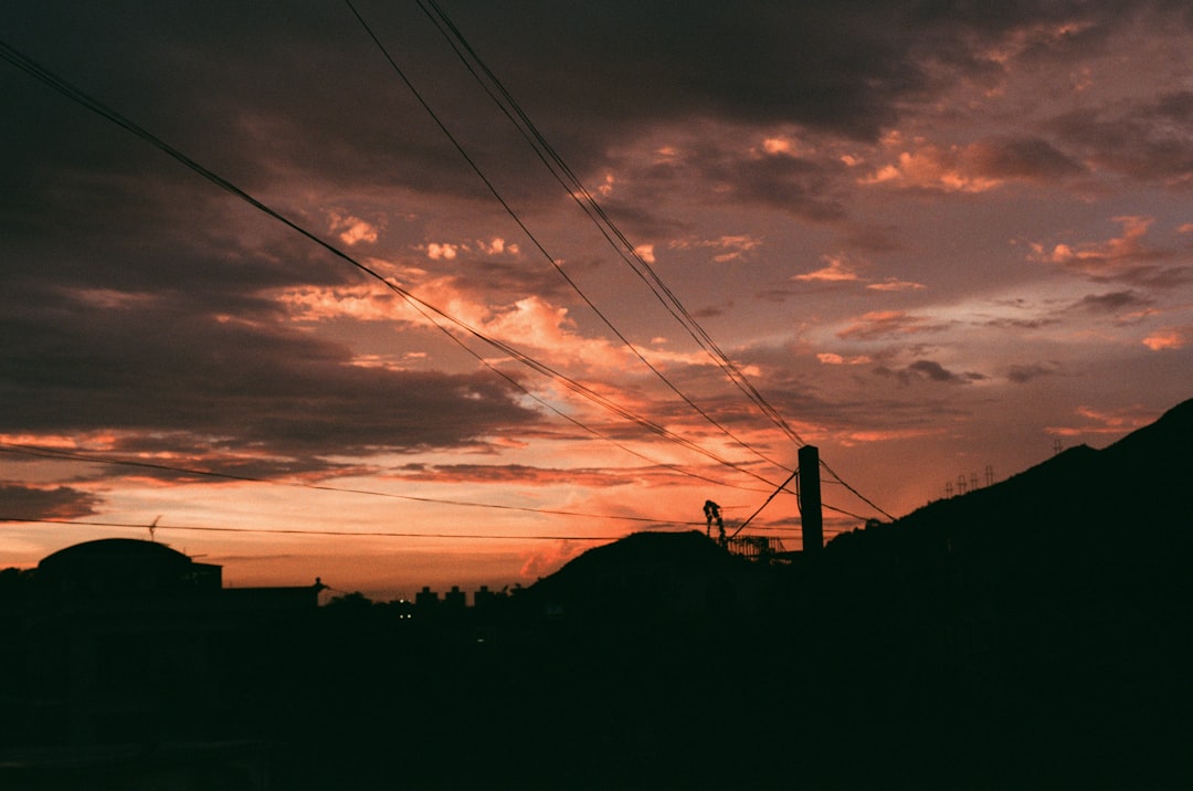 silhouette of electric post during golden hour