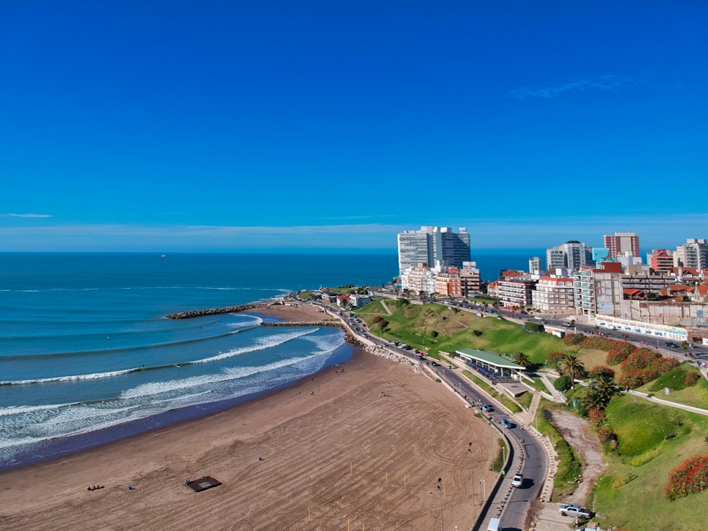 white and brown buildings and seashore