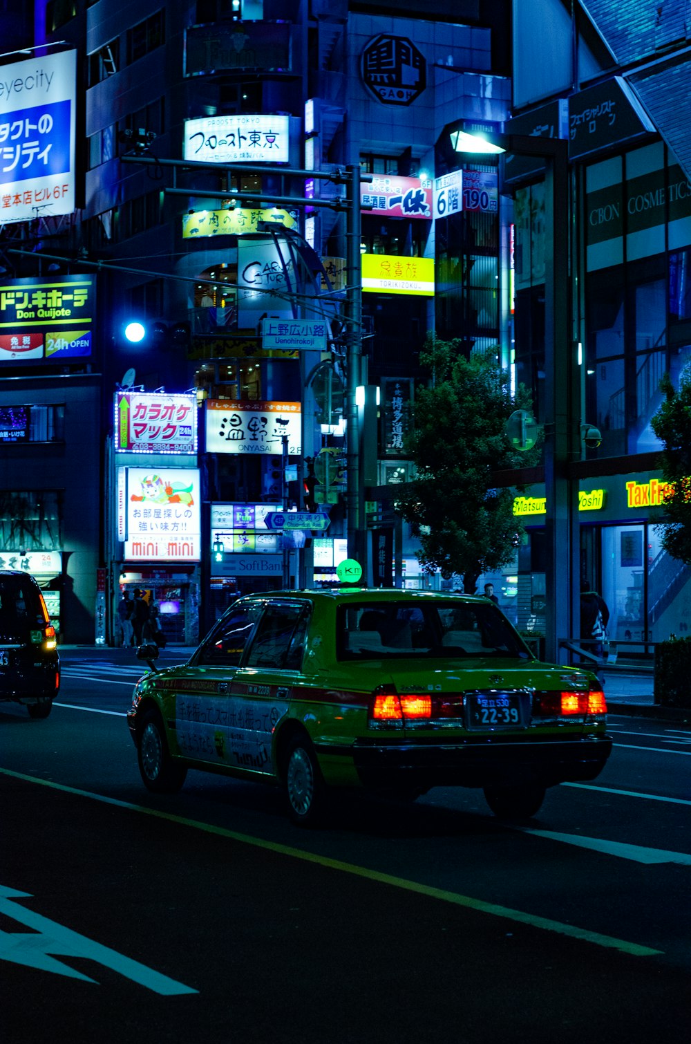 yellow sedan during nighttime