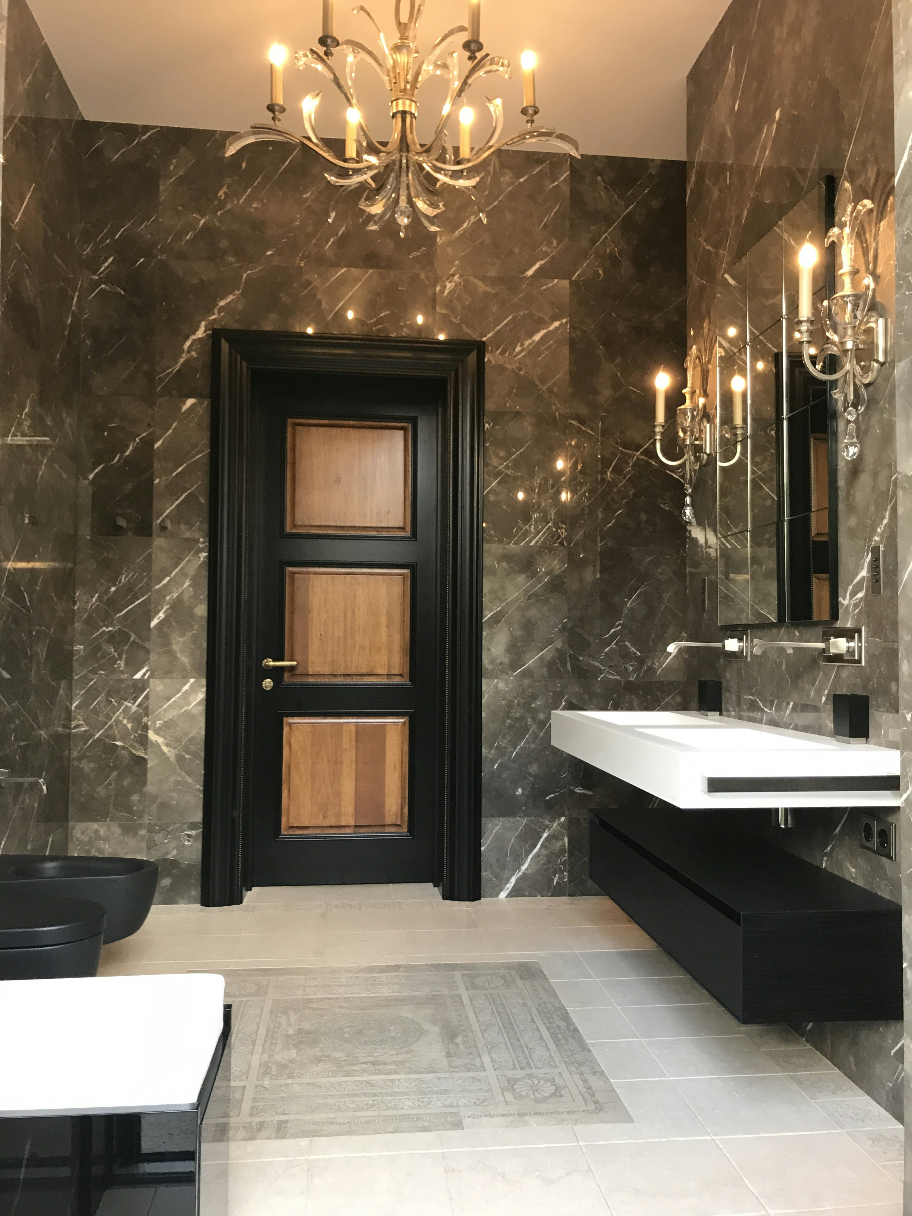 Modern luxury hotel bathroom with seamless microcement walls and premium fixtures showcasing elegant minimalist design