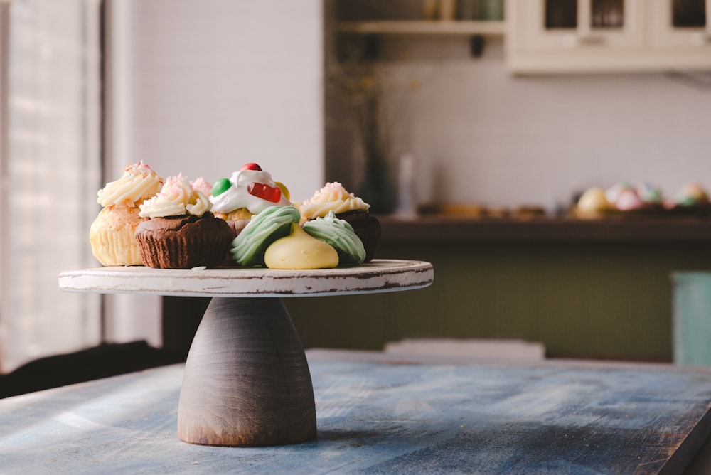 cupcake on round wooden board