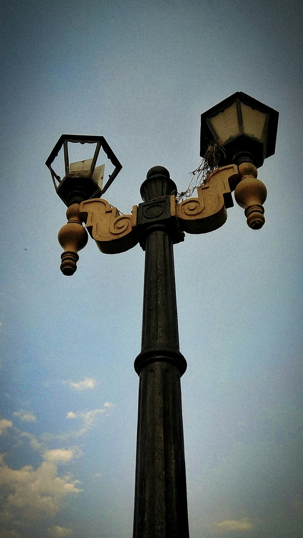 black and beige metal lamp post