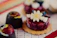 Close-up of a beautifully decorated assorted sweets platter from Carmen Sweets.