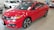 red Honda Civic coupe on display