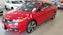 red Honda Civic coupe on display