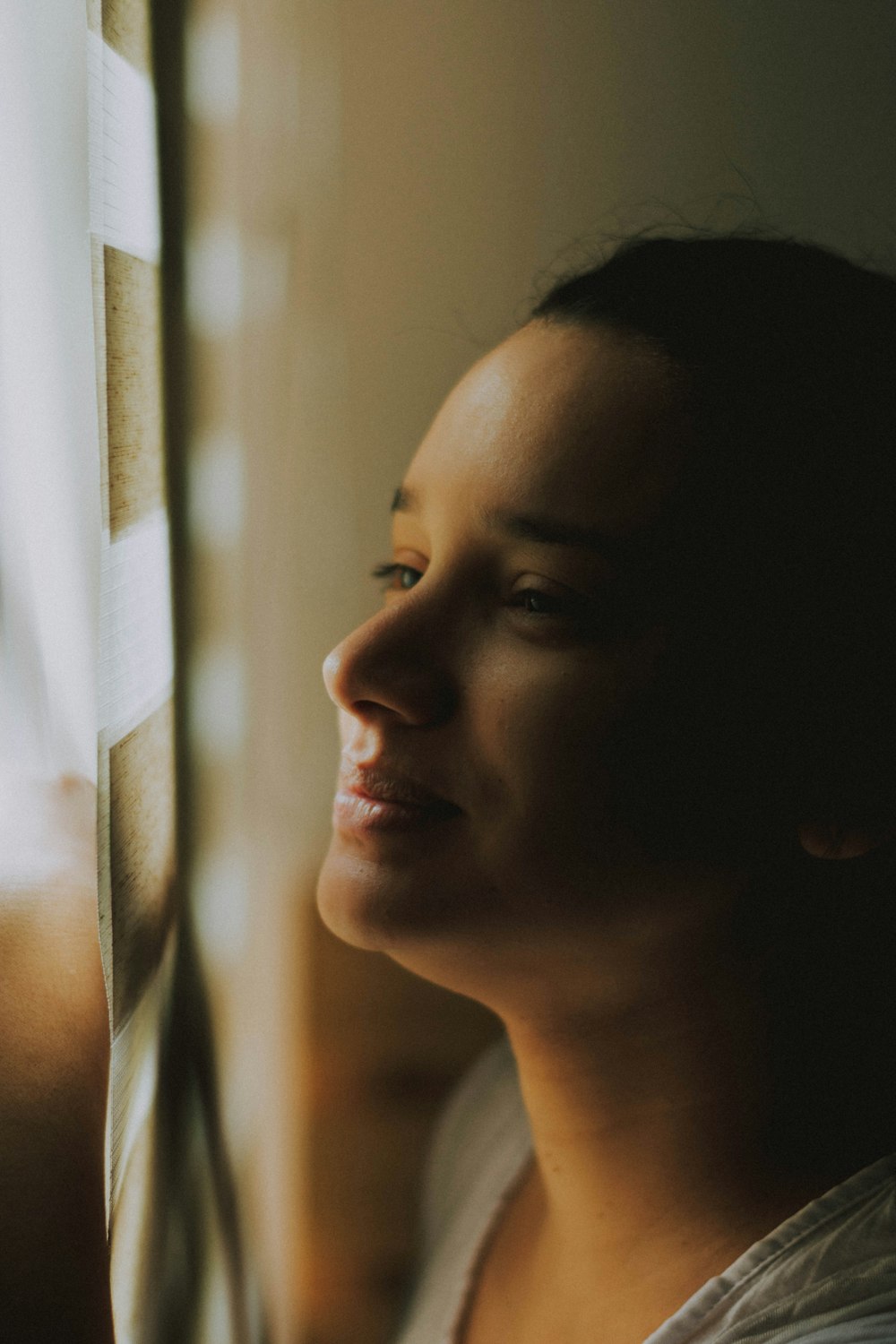 close-up photography of smiling woman inside room