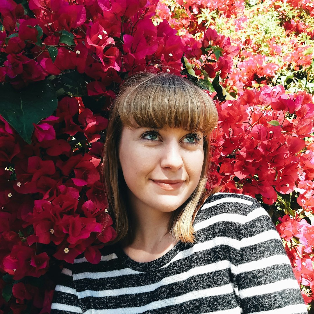 woman leaning on flowers