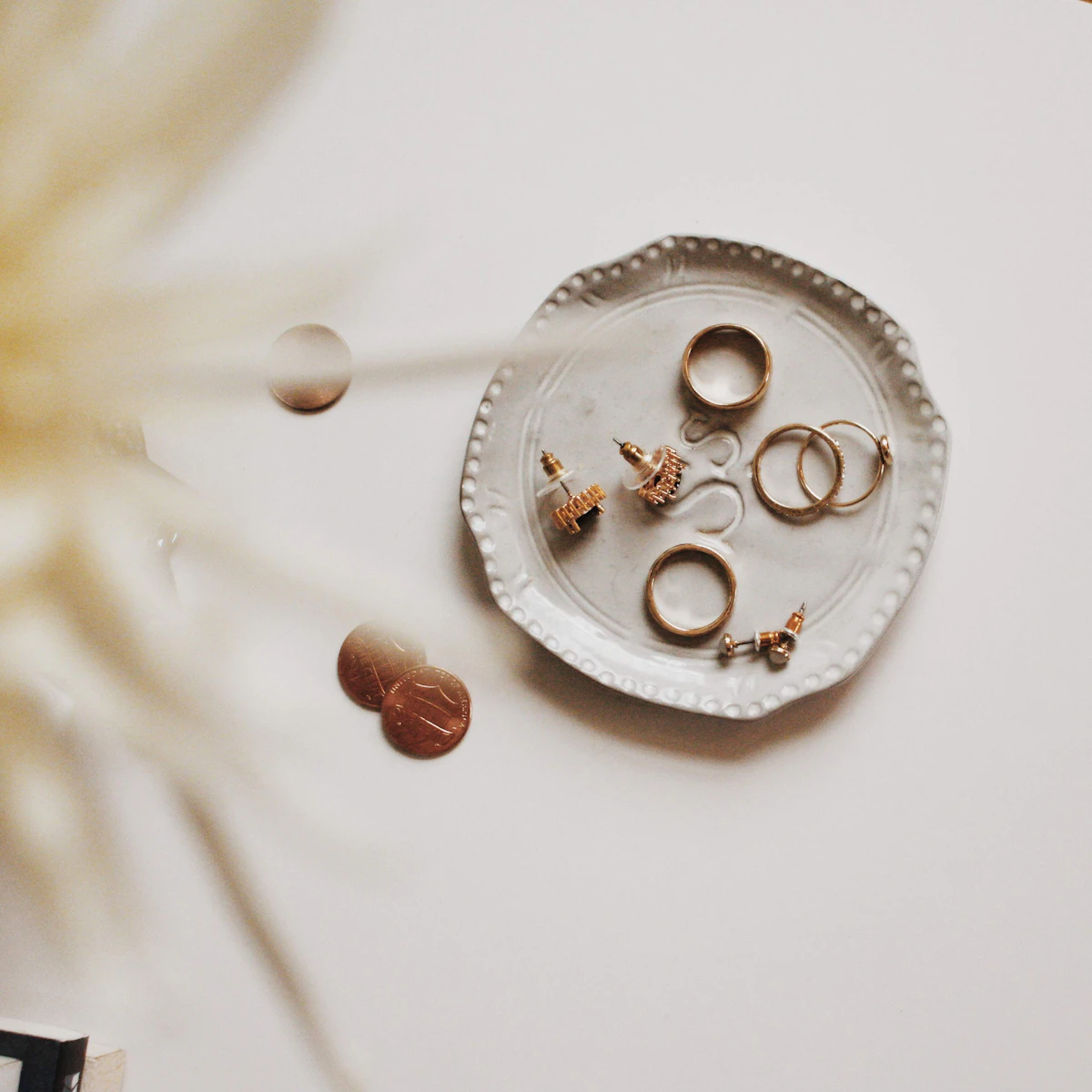 Before-and-after brooch comparison — tarnished vs restored