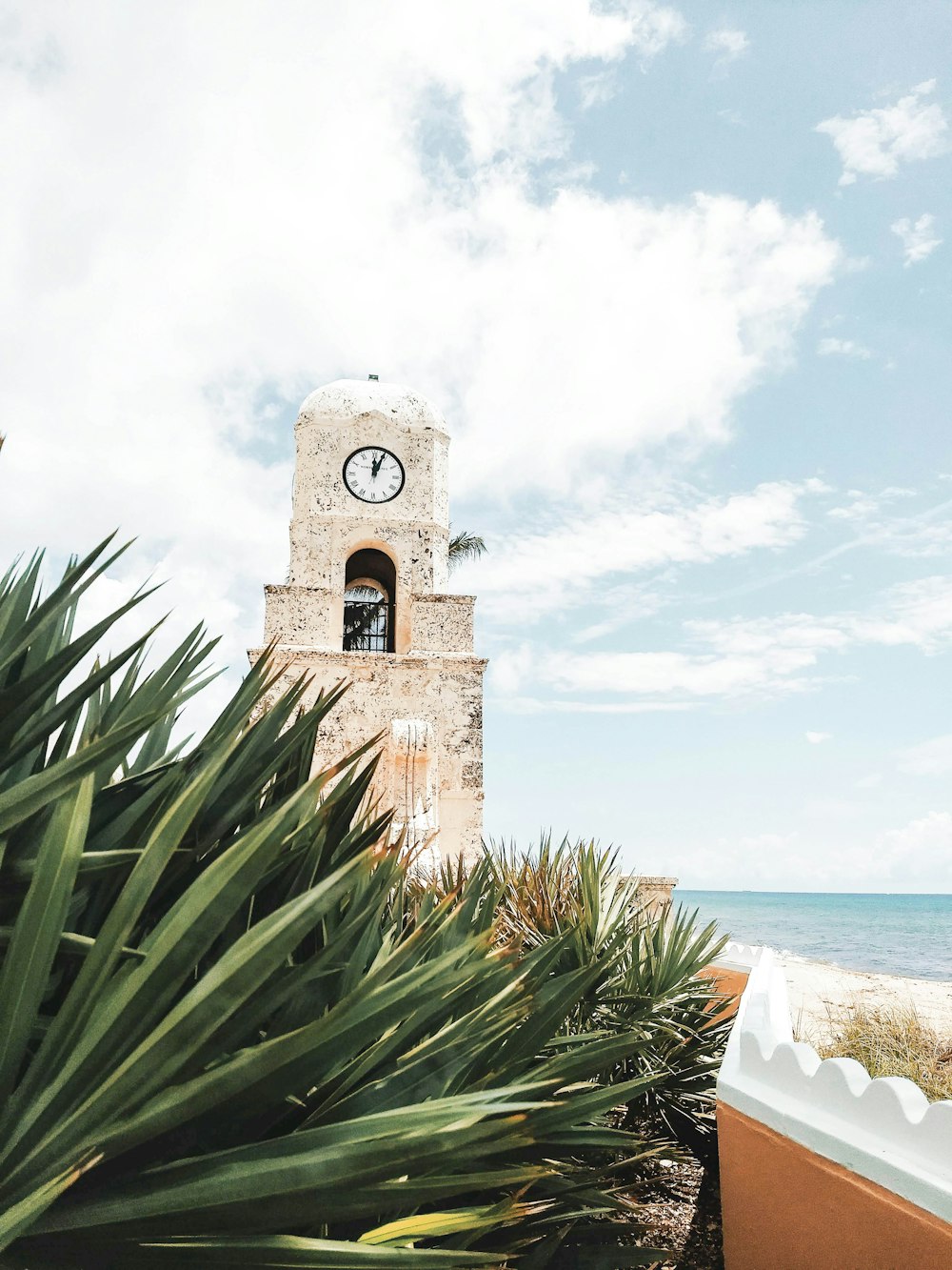 beige stone wall clock tower