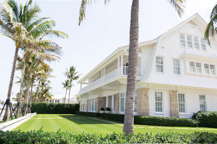 White Florida home among palm trees