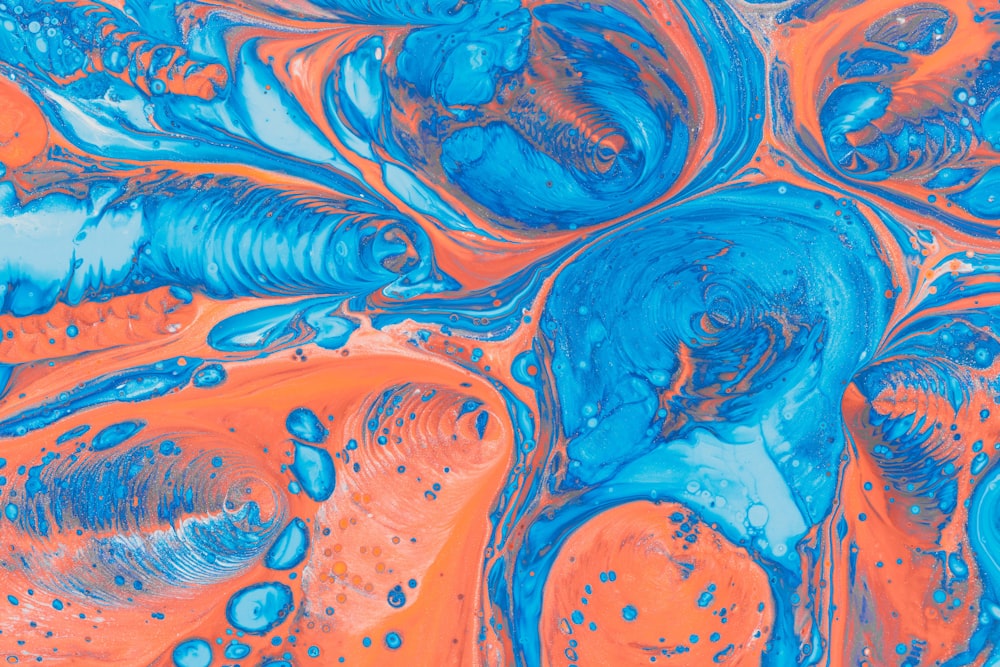 a close up of a blue and orange liquid