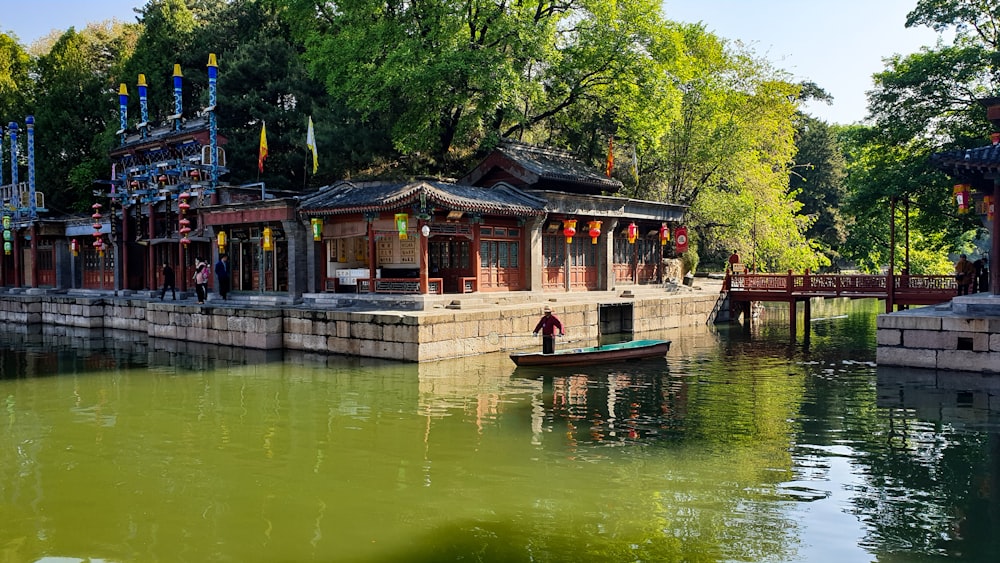 man standing boat in water