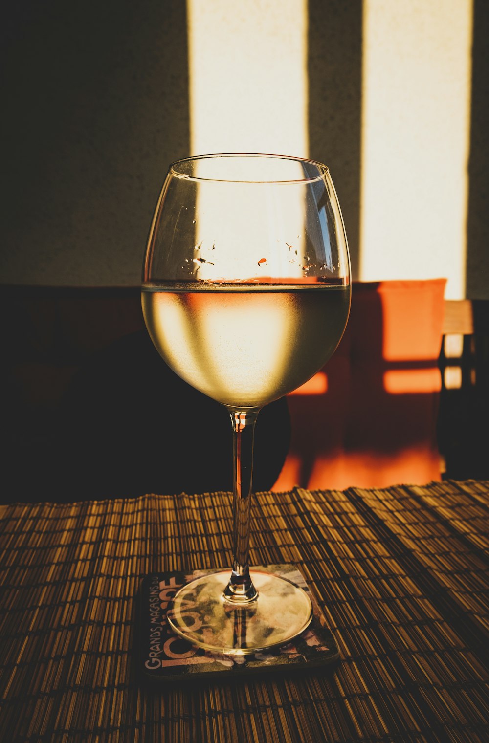 clear long-stemmed drinking glass on table