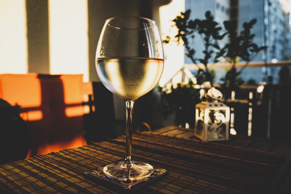 half-filled long-stem wine glass