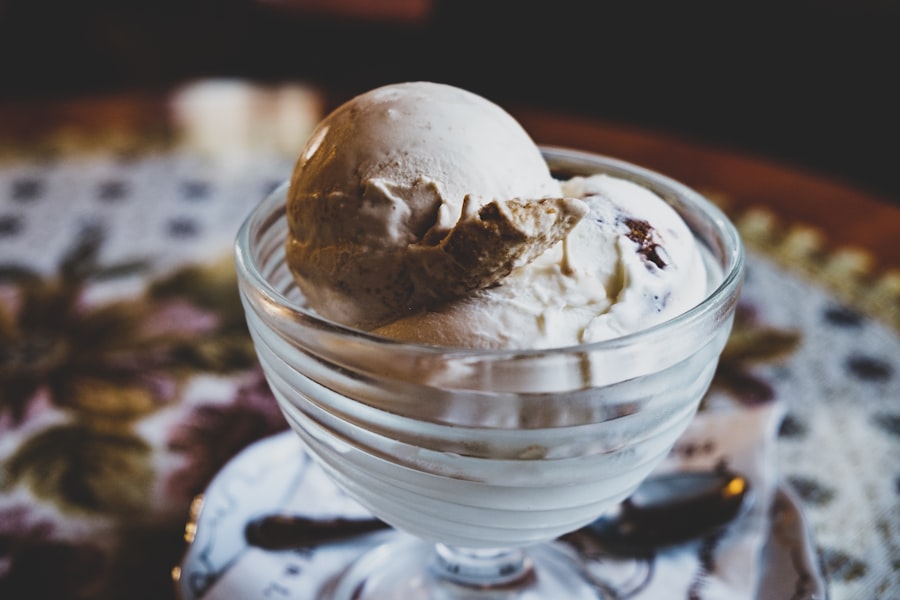 Scoops of cream-colored ice cream in a glass coupe