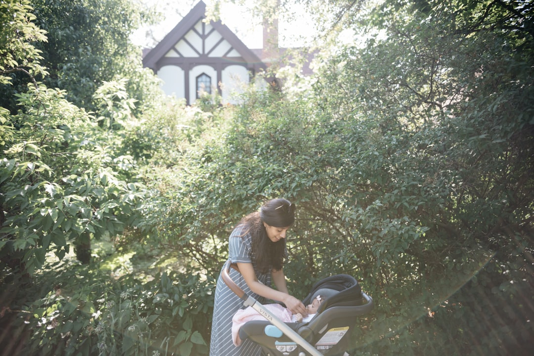 woman standing near stroller,