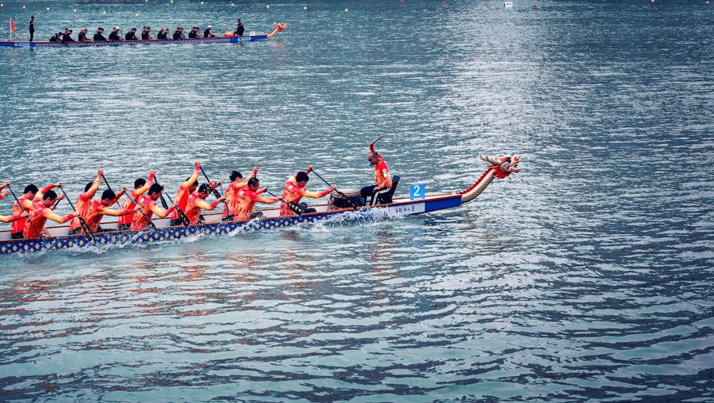 men on boat rowing