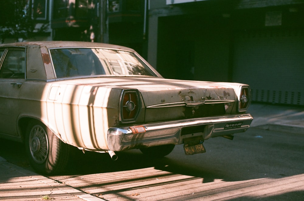 selective focus photography of beige sedan