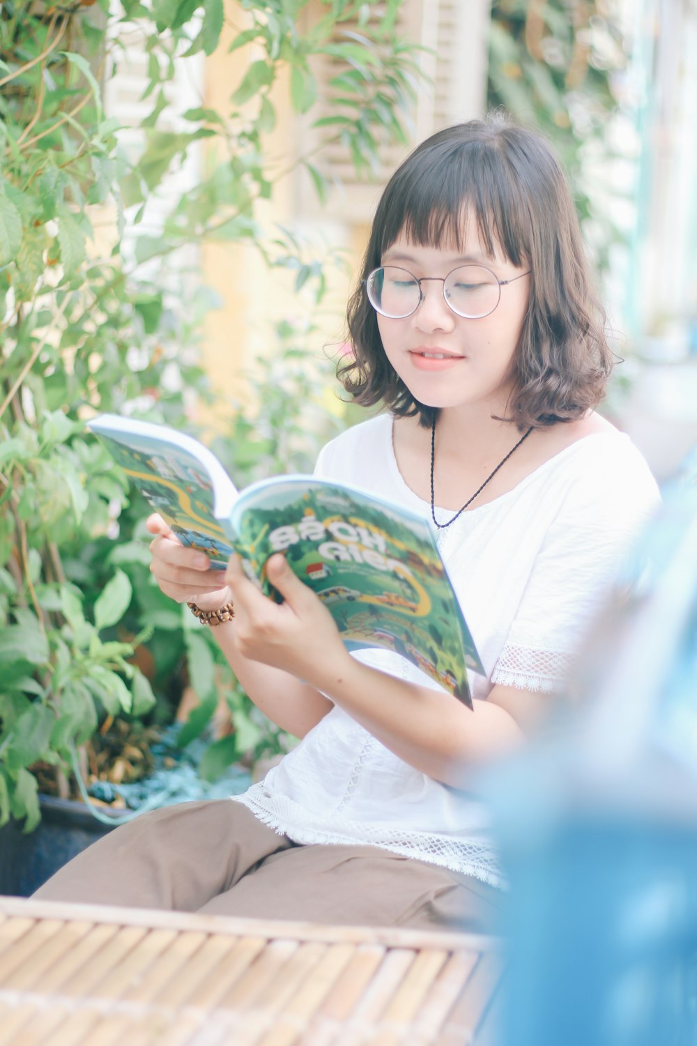 woman siting reading book