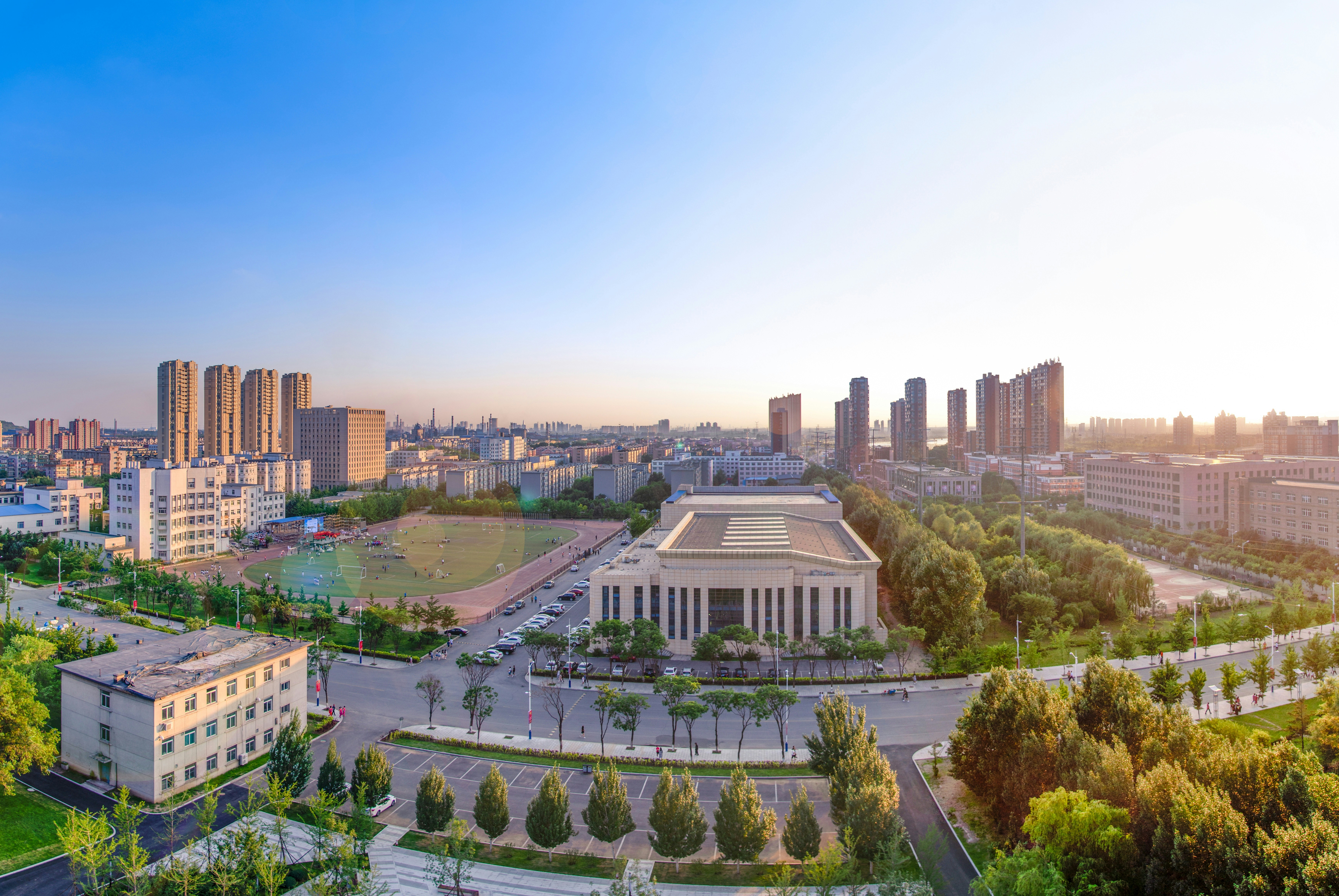 grey and white concrete building near trees