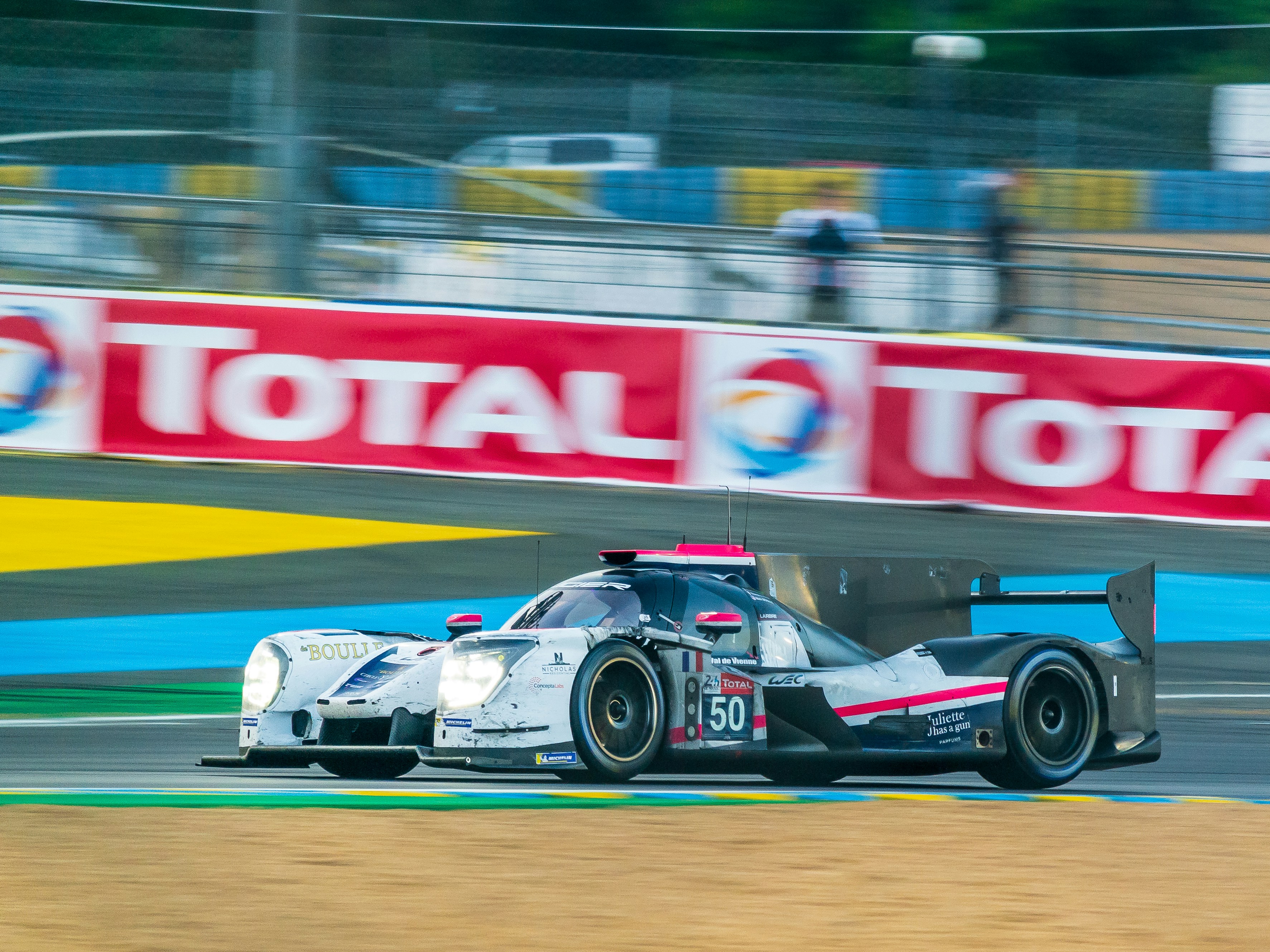Black and white race car during daytime photo Free Automobile Image