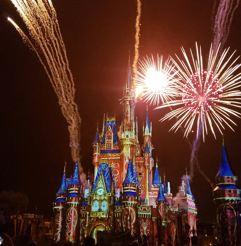 pink castle under fireworks