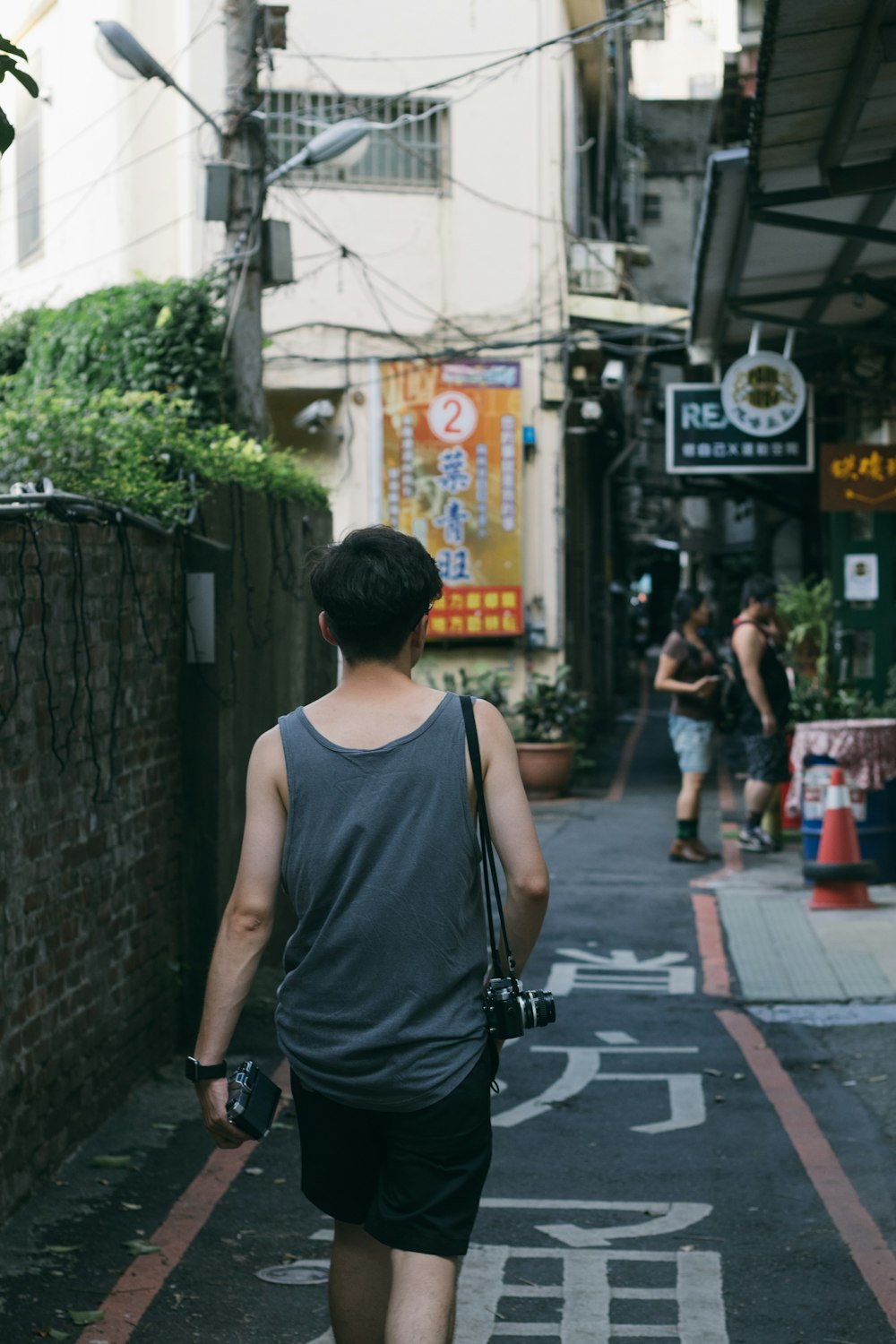 man wearing grey tank top