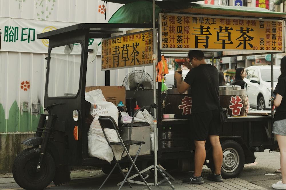 man on food cart