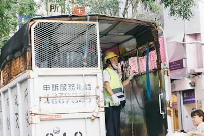 A carrier driver inspecting a trailer before departure, embodying safety and care.