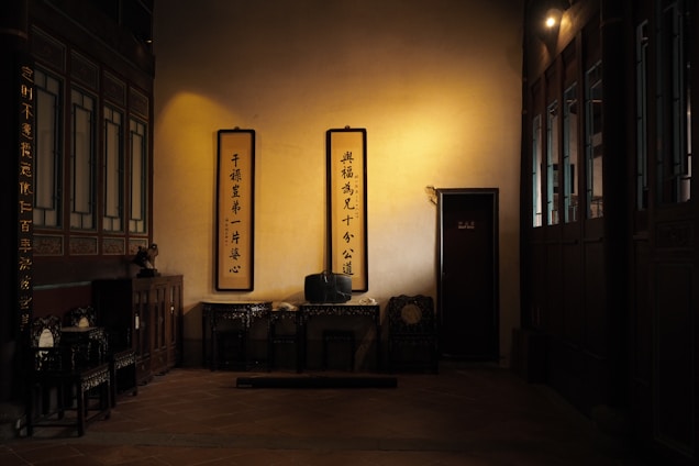 A serene consultation room with traditional Feng Shui elements and ancient Yi Jing texts.
