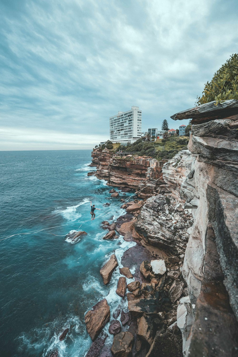 cliff near body of water during daytime
