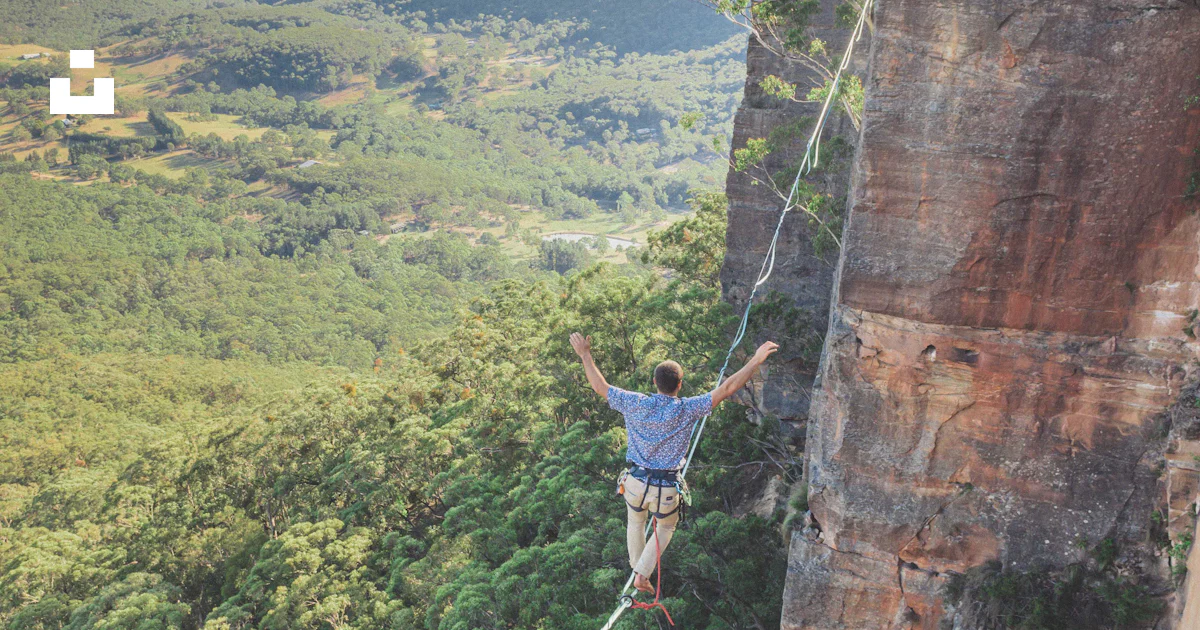 Man walking on string over the hill during daytime photo – Free Risk ...